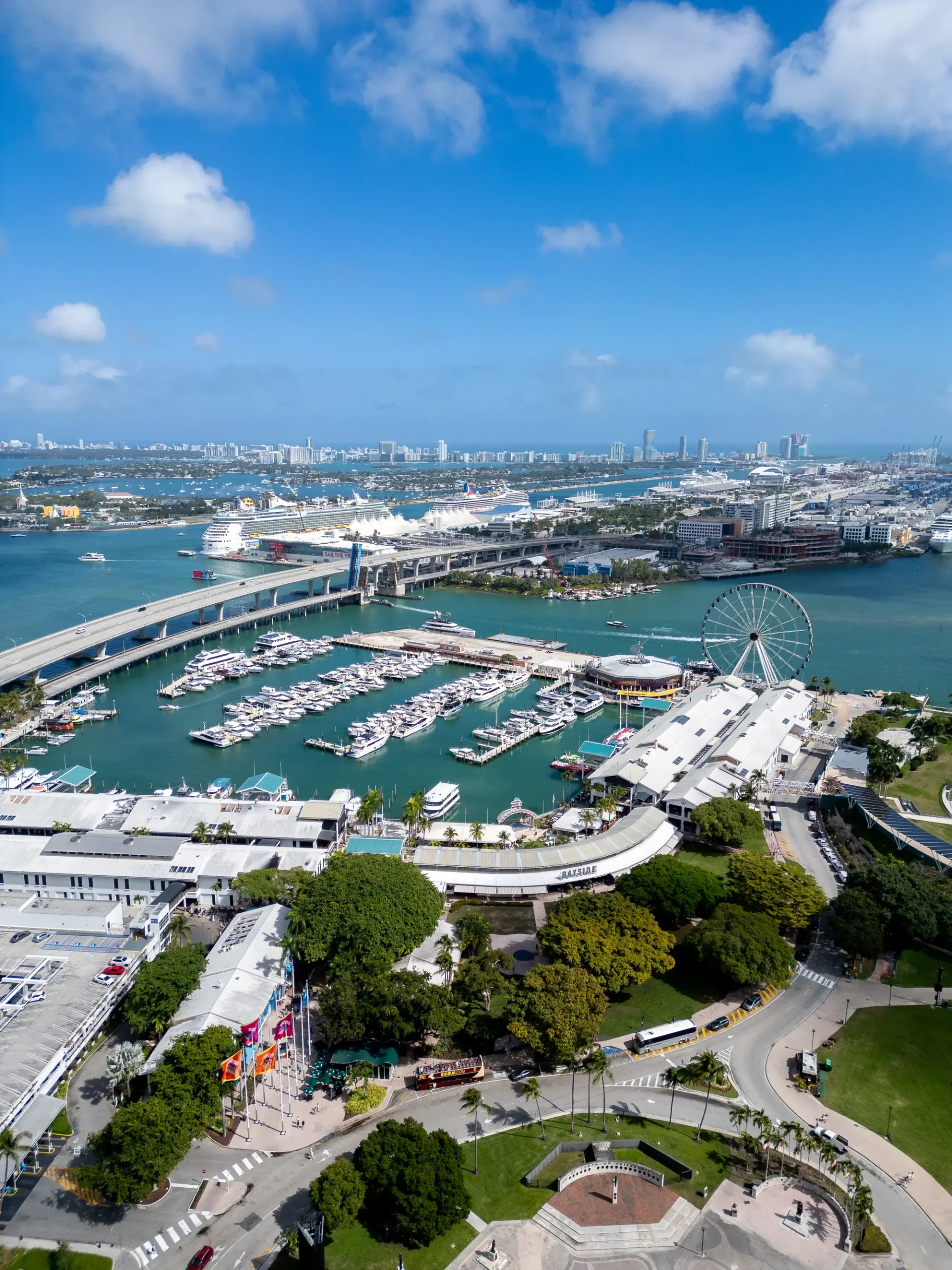 Vertical aerial of the Bayside Marketplace marina in downtown Miami near the Waldorf Astoria tower