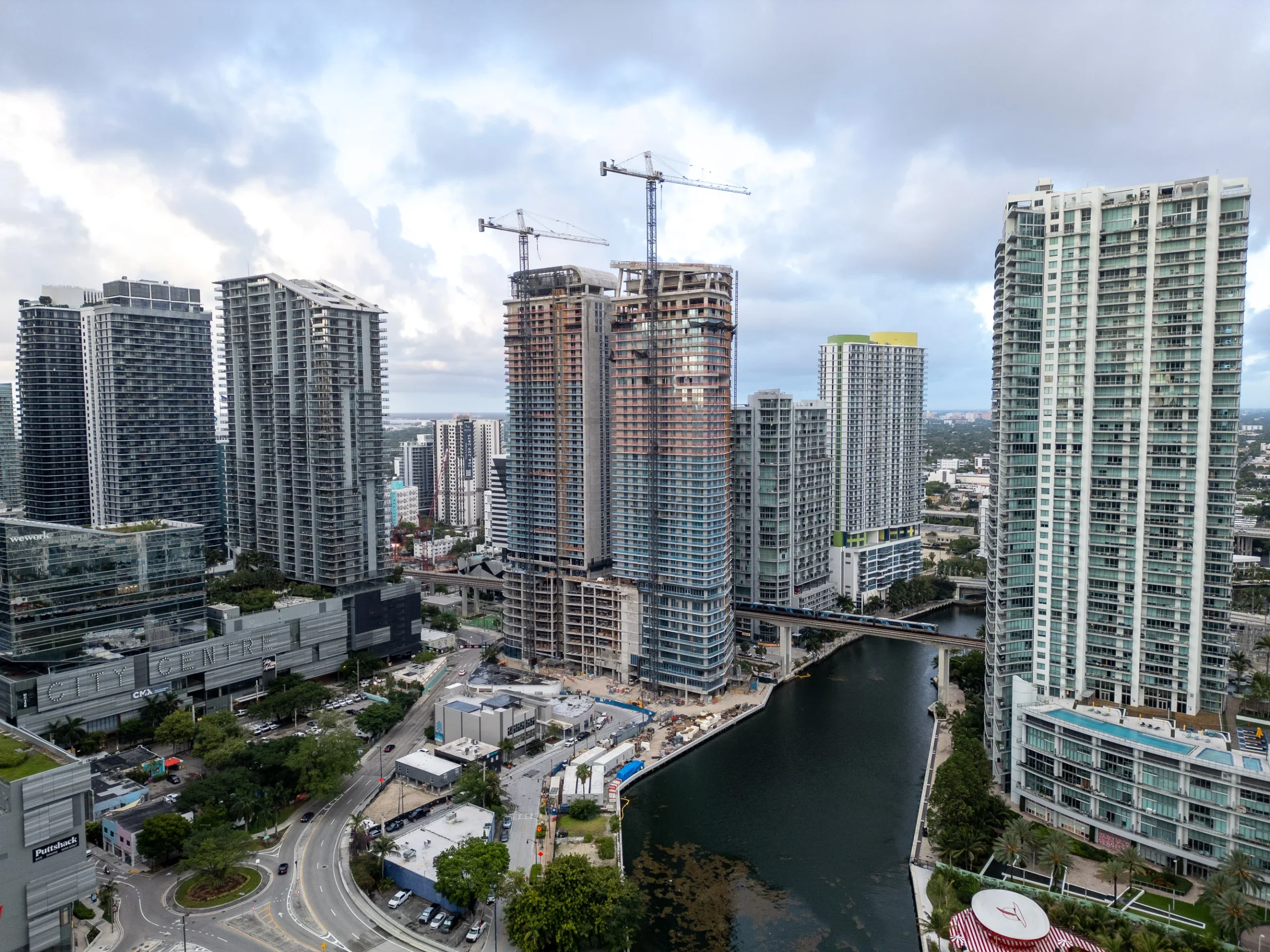 The Standard Residences and Lofty Brickell towers on the Miami River documented from the air by Drone Permission