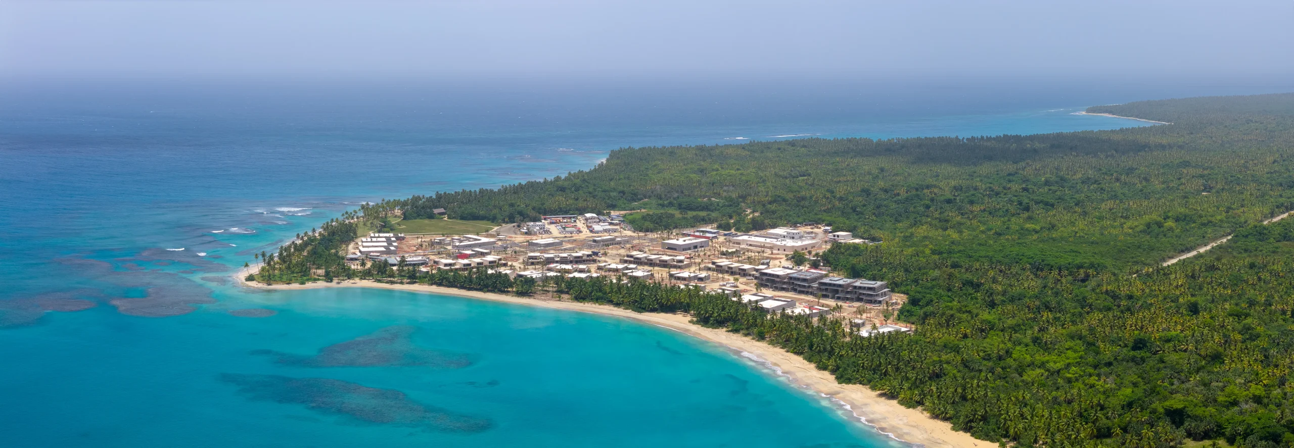Wide aerial panorama of the Tropicalia resort shoreline graded by Drone Permission