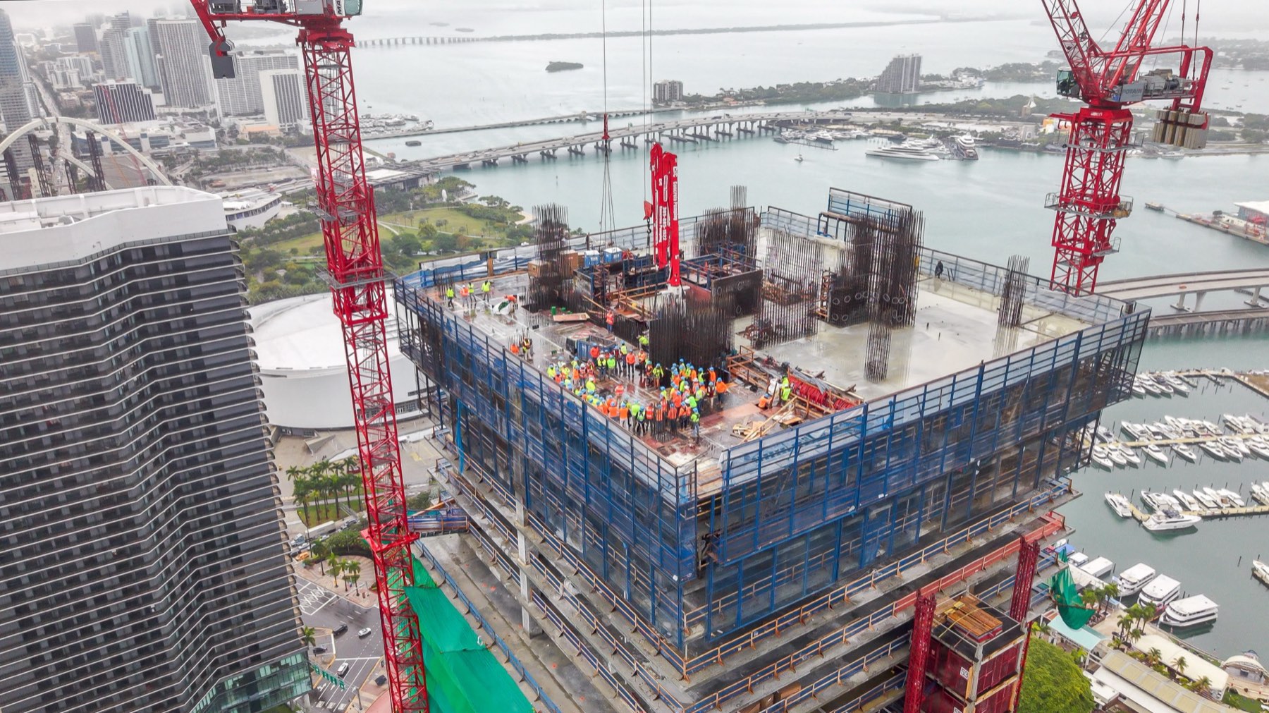 Construction crews on the top floor during the topping out ceremony at Waldorf Astoria Residences Miami, documented by Drone Permission