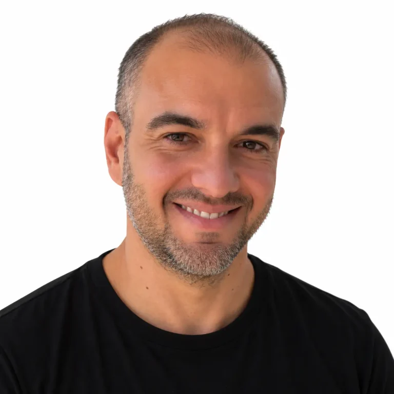 Bruno De Oliveira, Professional Photographer at Drone Permission, smiling in a black t-shirt against a white background