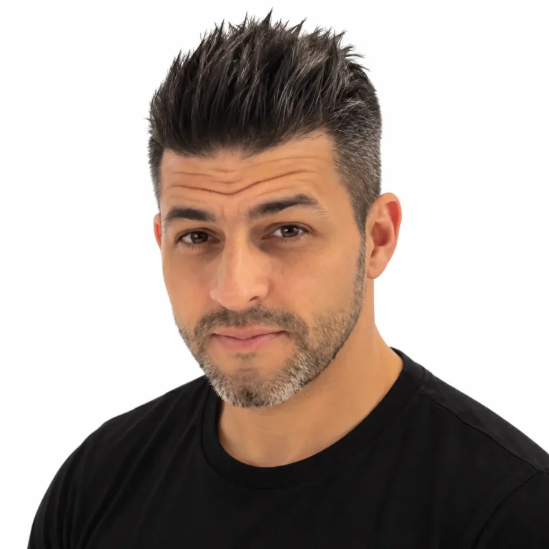 Simon Martinez, Professional Videographer at Drone Permission, in a black t-shirt against a white background